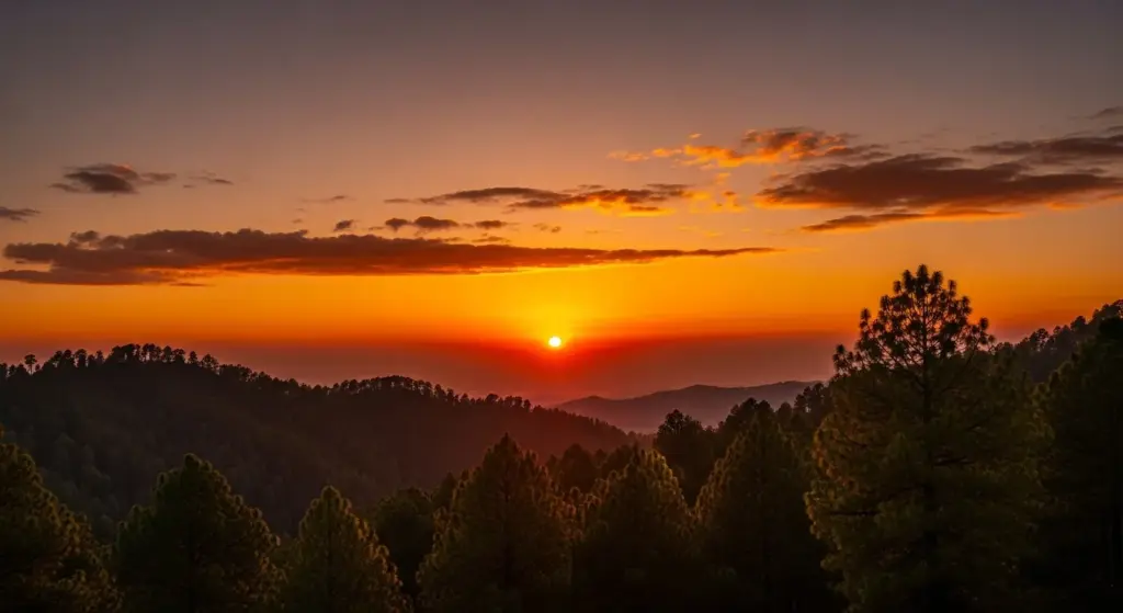 Ramgarh sunset with orange sky, pine trees silhouette, peaceful vibe